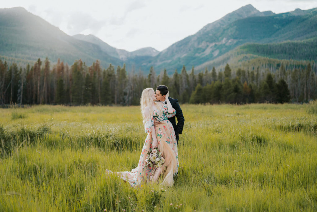 couple kissing after they just got married on the Bowen Baker Trail in RMNP.
