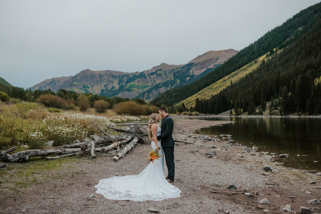 eloping couple looking into each other eyes during their Maroon Bells elopement.