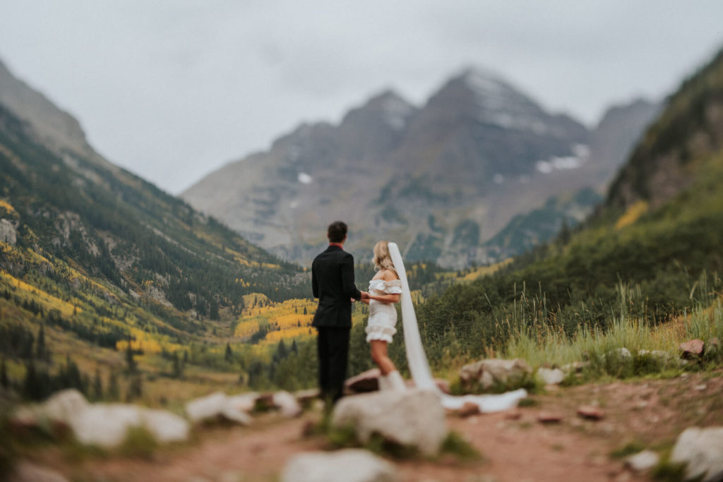 couple enjoying the view during their Maroon Bells Amphitheater ceremony.